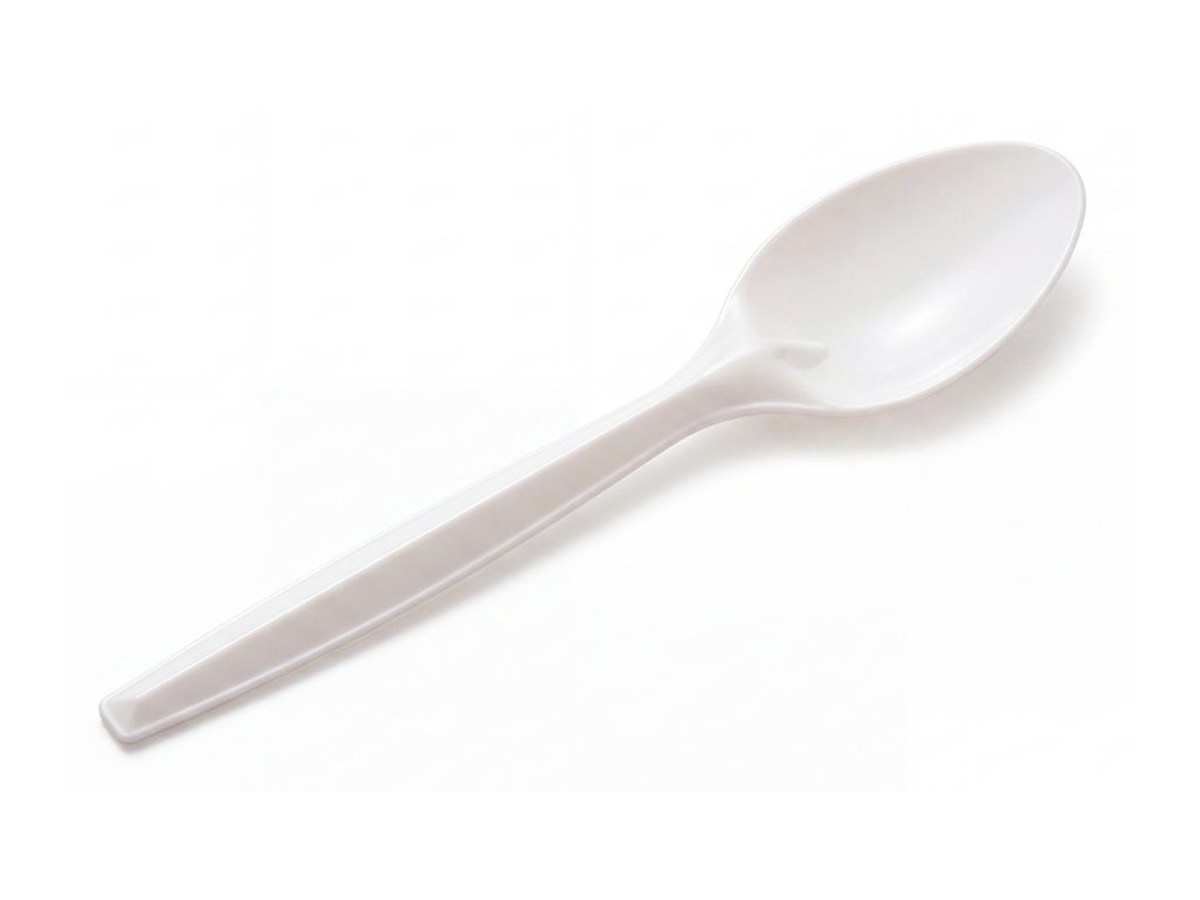 White disposable spoon on a white background
