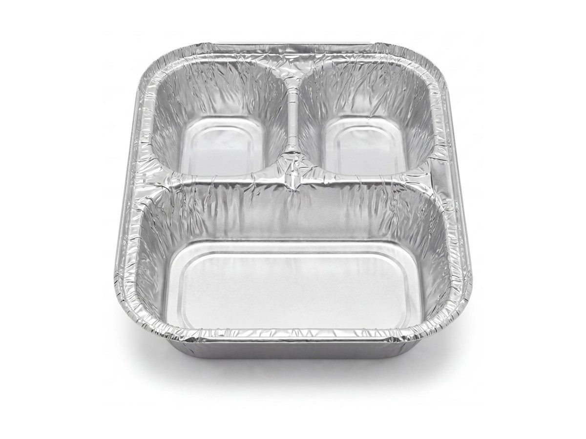 Three-compartment silver aluminum foil tray on a white background
